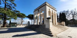 Travertine arches and bronze braziers of the Mausoleo Ossario Garibaldino on Janiculum Hill in Rome